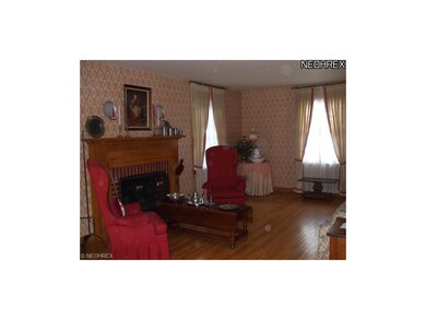 Lovely spacious living room with fireplace.