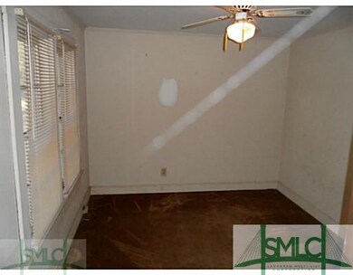 Bedroom. Front bedroom one of three. Hardwoods und