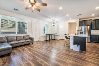 Living area with recessed lighting, dark wood finished floors, and ceiling fan