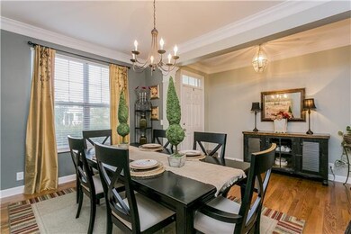 Come on in. Greet guests in open foyer with lovely dining room