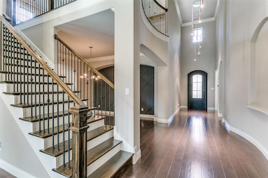 View of the entry, dining room and stairs from the living room.