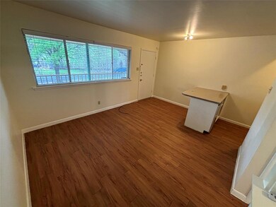 Empty room with plenty of natural light and wood 