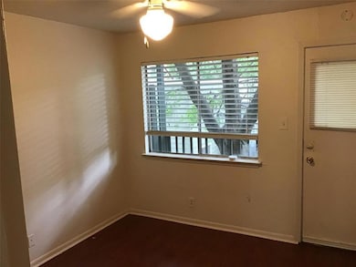 Empty room featuring a ceiling fan, baseboards, a