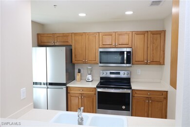 Kitchen featuring appliances with stainless steel