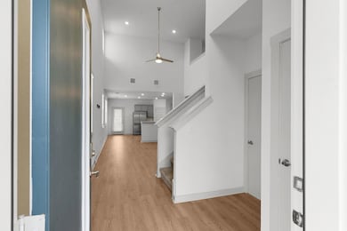 Foyer featuring light wood-style flooring, a ceil