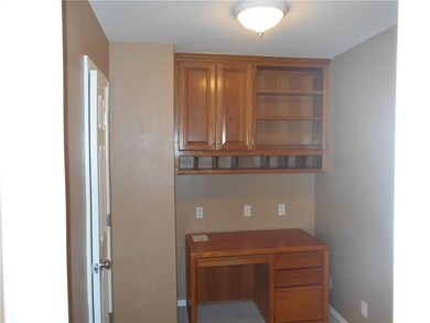 Office way with built-ins adjoins Master