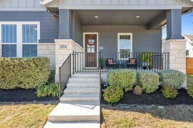 View of exterior entry featuring stone siding, a 