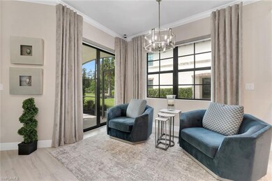 Living area featuring crown molding, wood-type flo