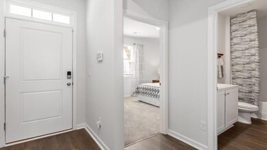 Entrance foyer with dark wood-type flooring