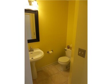 Bathroom. Half bath on main living level has ceram