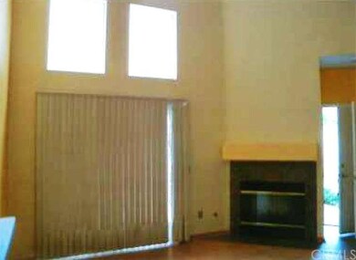 Fireplace and slider in living room.