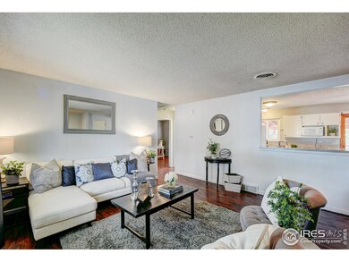 Upstairs living room open to the kitchen