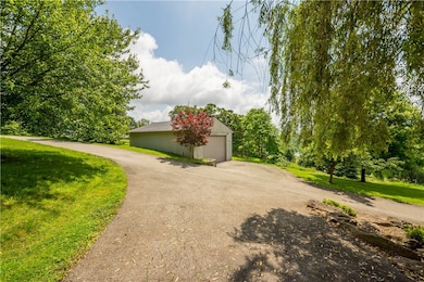 Amazing 4 car detached garage is in addition to th