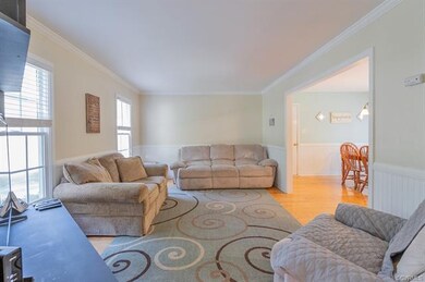 Beautiful hardwood floors throughout the downstairs and a nice big opening between living room and kitchen.