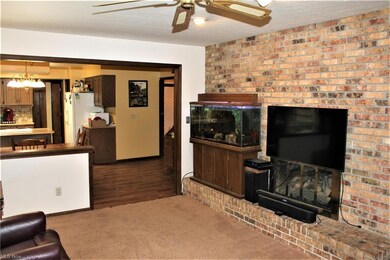 Family Room with Gas Logs in Wood Burning Fireplac