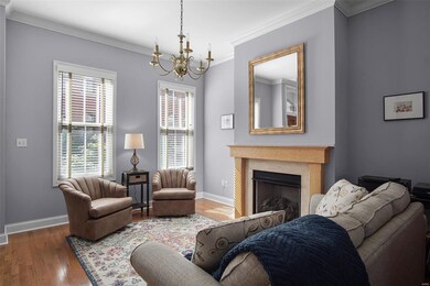 Living room with crown molding and gorgeous hardwo