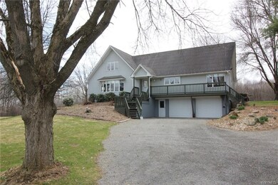 Great curb appeal with perennial gardens and a bea