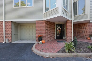 Entrance to property featuring a garage