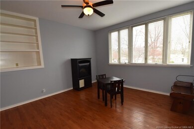 Living room showing the built in bookcase shelving