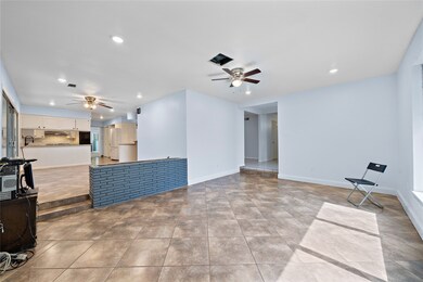 Second view of formal dining.  Half wall has a pla