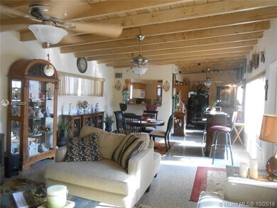 View of living room, dining room, and kitchen