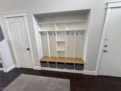 Mudroom with baseboards and wood finished floors