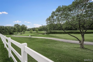 View of yard with a golf course water view