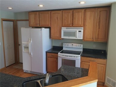 Reverse angle of the kitchen, showcasing the lovel