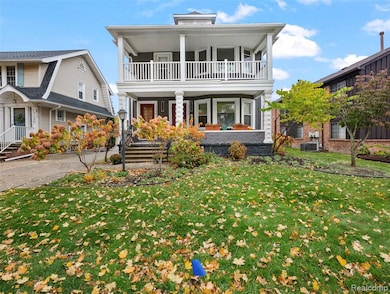View of front facade featuring a porch and a front yard