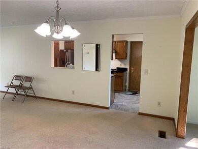 Kitchen is off the dining area with pass through.