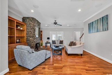 Living area with light wood-type flooring, baseboa