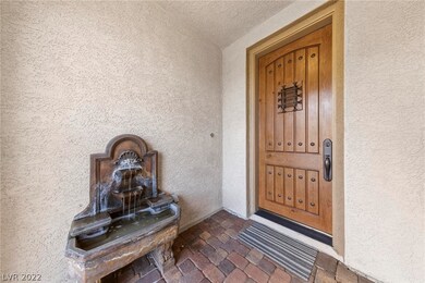 FRONT PORCH WITH FOUNTAIN AND SOLID WOOD ENTRY DOO