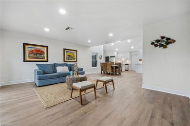 Living room featuring light hardwood / wood-style 