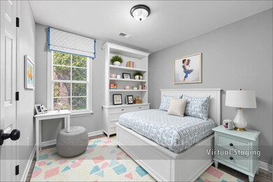 Bedroom with baseboards and wood finished floors