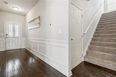 Foyer entrance featuring stairs, visible vents, da