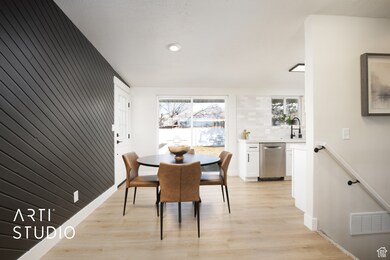 Dining room featuring light wood-style flooring and recessed lighting