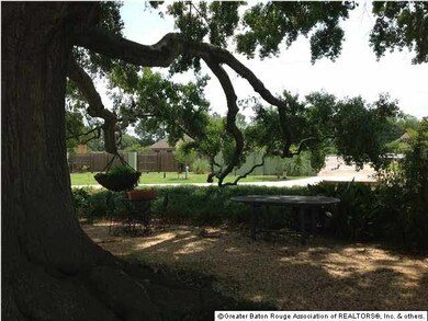 VIEW OF GATE ENTRANCE FROM UNDER TREE