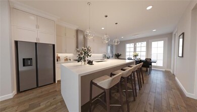 Kitchen with a sink, hardwood / wood-style floors,