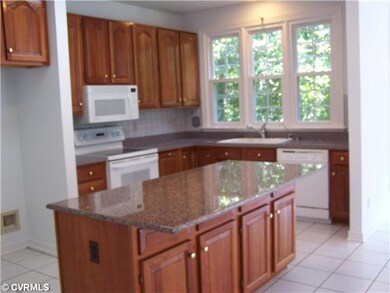 Kitchen - Bright kitchen overlooks private rear wo