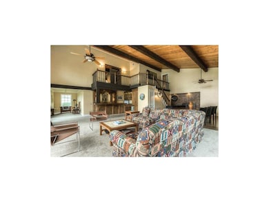 The stunning great room highlights an open beam va