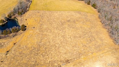 Aerial view of sparsely populated area with a nearby body of water