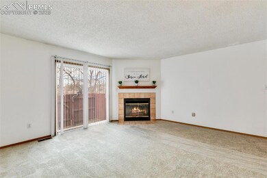 Unfurnished living room with light colored carpet,