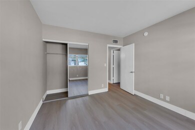 Second bedroom with wood like flooring and great c