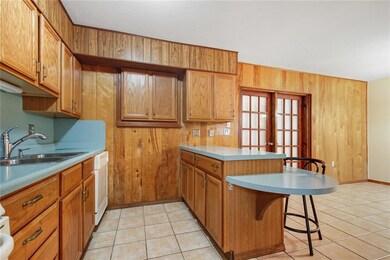 Kitchen with bar seating.