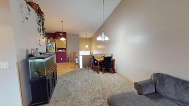 Open concept floor plan w/ vaulted ceiling.