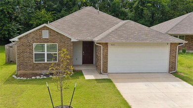 View of front of property featuring a garage and a