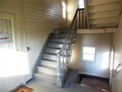 Stairs lead to 2nd fl unit & to Basement