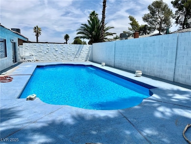 View of swimming pool featuring a fenced backyard