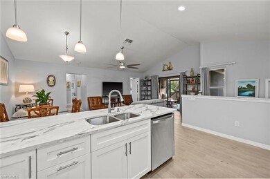 Kitchen featuring white cabinetry, light wood-type