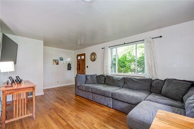 The abundant natural light highlights the warm beauty of the hardwood floors, which are found throughout most of the first floor.